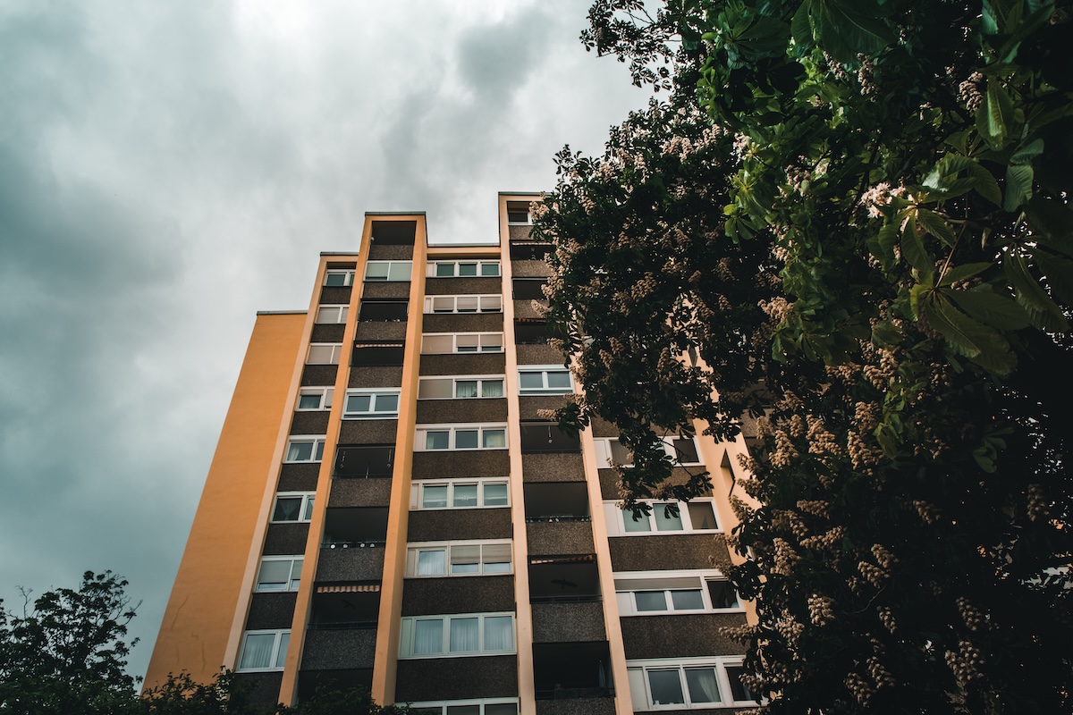 Low angle shot of a building in a gloomy sky background